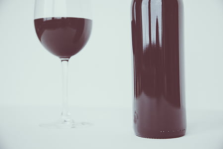 clear wine glass and wine bottle thumbnail