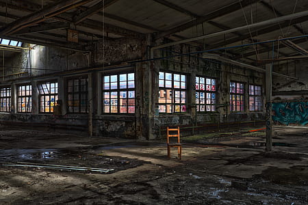 brown wooden chair inside building at daytime thumbnail