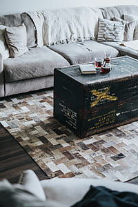 rectangular black wicker table beside gray sofa thumbnail