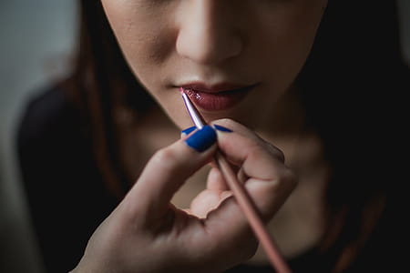 Woman Getting Lip Makeup Photo thumbnail