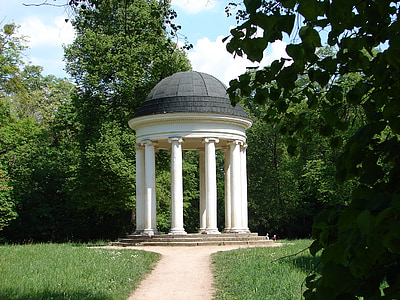 black and white concrete gazebo in between grass field thumbnail