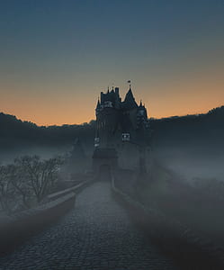 gray castle surrounded by fog thumbnail