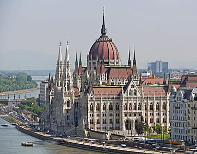 aerial photo of brown and white cathedral during daytime thumbnail