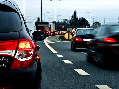 cars driving on the road during daytime thumbnail