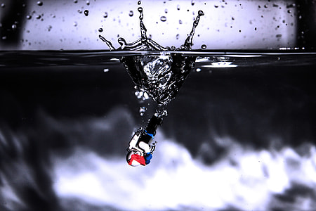 black and white device sinking on water thumbnail