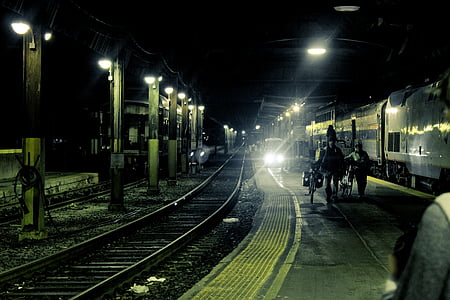 empty train rails during night time thumbnail