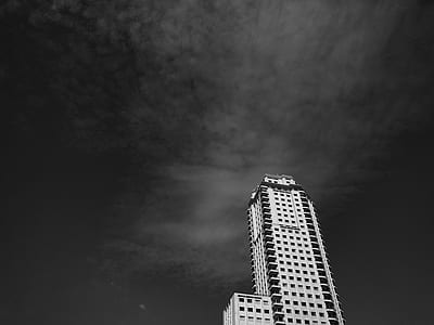 low-angle photography of white concrete building thumbnail