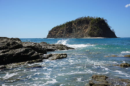 green leaf trees on brown rock formation at daytime thumbnail