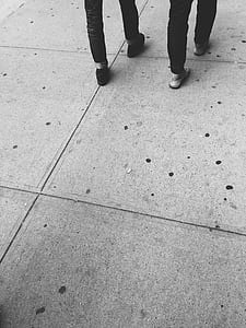 grayscale photography of two person walking thumbnail