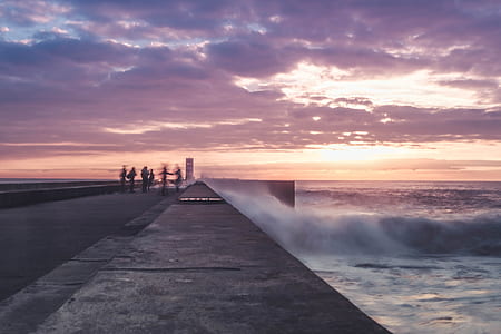 photo of person standing near sea thumbnail