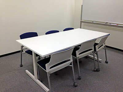 rectangular white table with six chairs on gray floor thumbnail