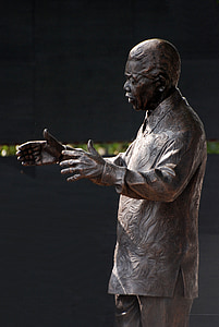 man concrete statue at daytime thumbnail