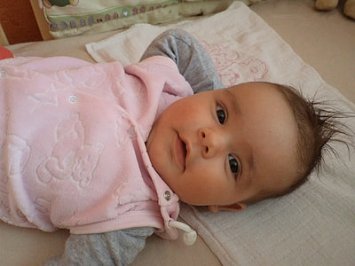 baby lying on bed thumbnail