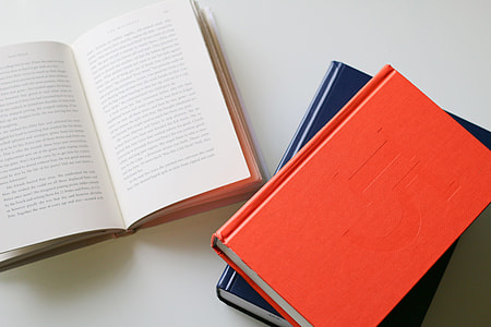 Books resting on a white table thumbnail