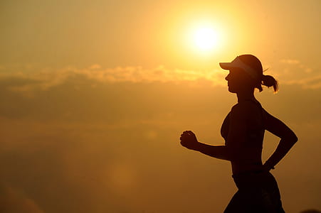 silhouette of woman running during sunset thumbnail