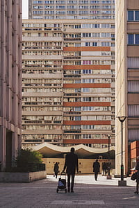 man walking towards building thumbnail