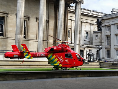 red G-EHMS helicopter near white concrete museum thumbnail