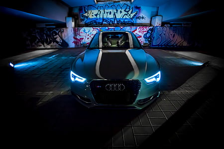 green Audi car on gray pevement thumbnail