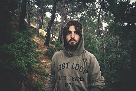 man standing inside the forest thumbnail