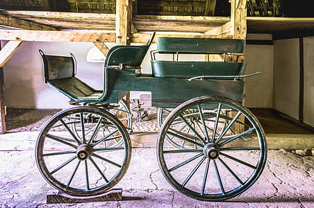 green carriage near table thumbnail