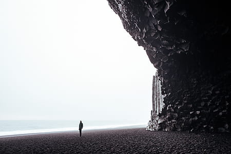 person standing near beach during daytime thumbnail