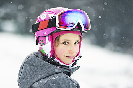girl wearing pink helmet and snow goggles thumbnail