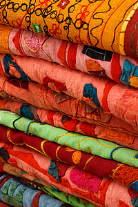 close-up photo of piled up folded textiles thumbnail