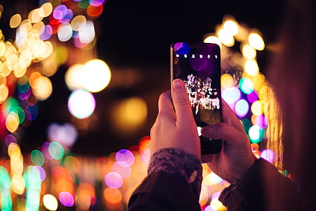 person holding black smartphone thumbnail