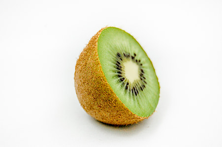 slice of kiwi on white surface thumbnail