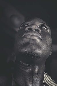Grayscale Photo of Man Looking Up thumbnail