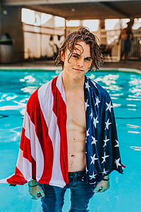 man wearing flag of America scarf thumbnail