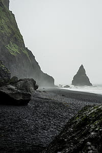 waves crashing rocks on coastline thumbnail