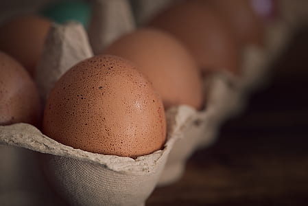selective focus photography of brown eggs on tray thumbnail