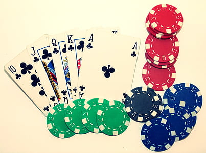 five playing cards beside poker chips thumbnail