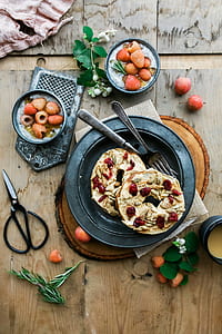 cooked food on round gray plate with two forks thumbnail