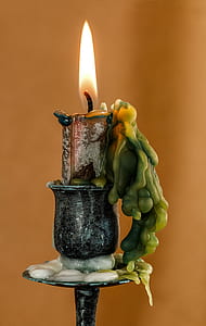 candle on metal stand thumbnail