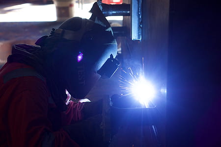 person welding metal thumbnail