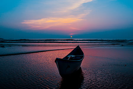 boat on water during sunset thumbnail