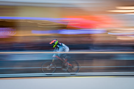 person riding bicycle time lapse photo thumbnail