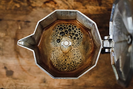 stainless steel pitcher filled with coffee thumbnail