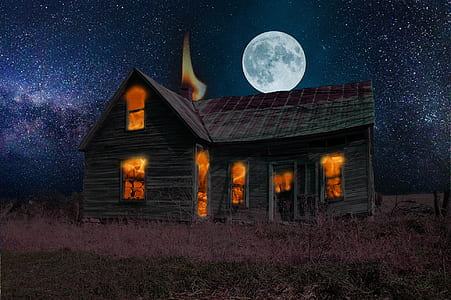 gray and brown wooden house under white full moon at night thumbnail
