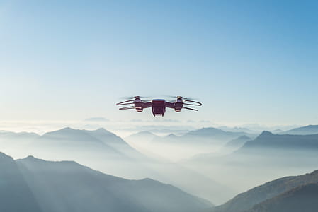 black drone quadcopter flying during daytime thumbnail