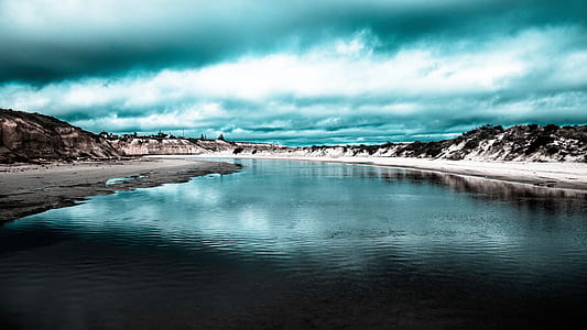 calm body of water in the middle of islands thumbnail
