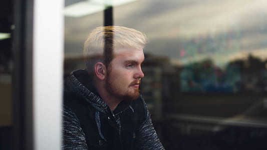 man looking out the window thumbnail