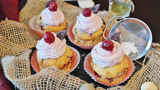 four brown cupcakes with white icing-cover thumbnail
