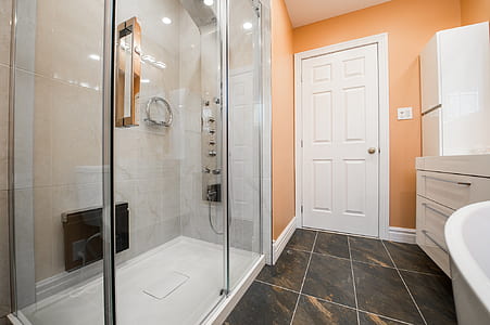 clear glass bathroom and closed white wooden door thumbnail