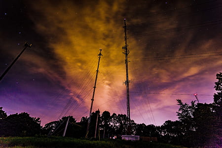 low-angle photo of utility poles thumbnail
