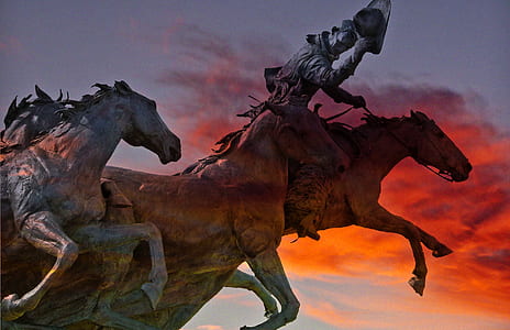horse statue under cloudy sky thumbnail