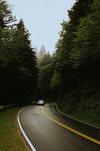 car along highway during daytime thumbnail