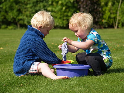 two children washing clothes thumbnail